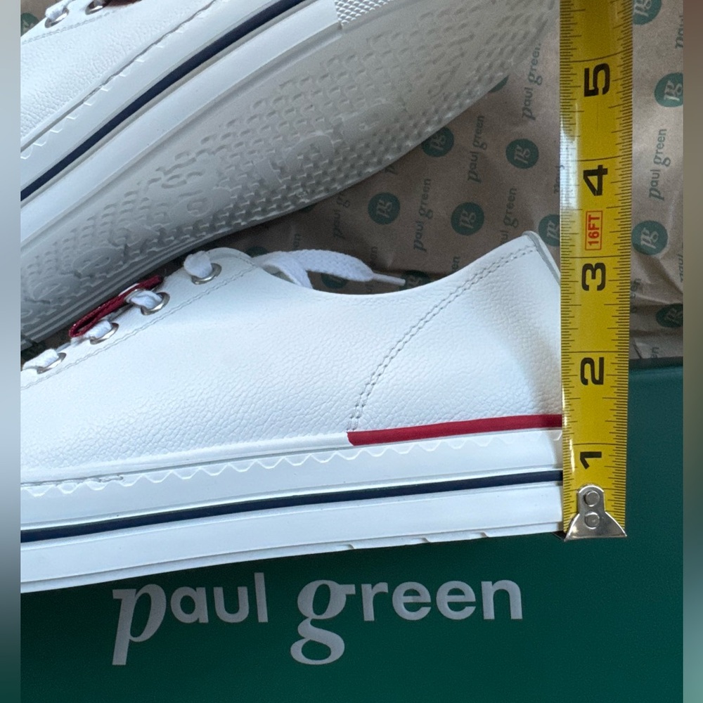 White leather Sneaker. Low top. US 10.5 Never worn. .